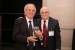 Dr. Nagib Callaos, General Chair, giving Dr. Mario Lamanna a award "In Appreciation for Delivering a Great Keynote Address at a Plenary Session."